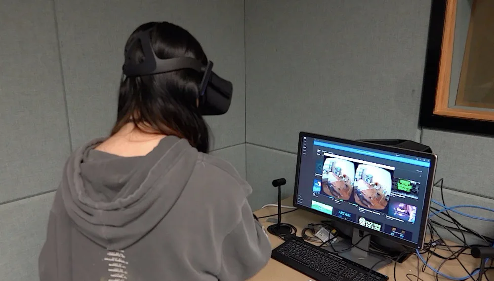 Student wearing VR headset, investigating virtual crime scene