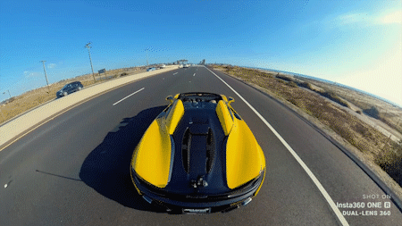 A gif showing a hyperlapse video of a sports car driving down a road