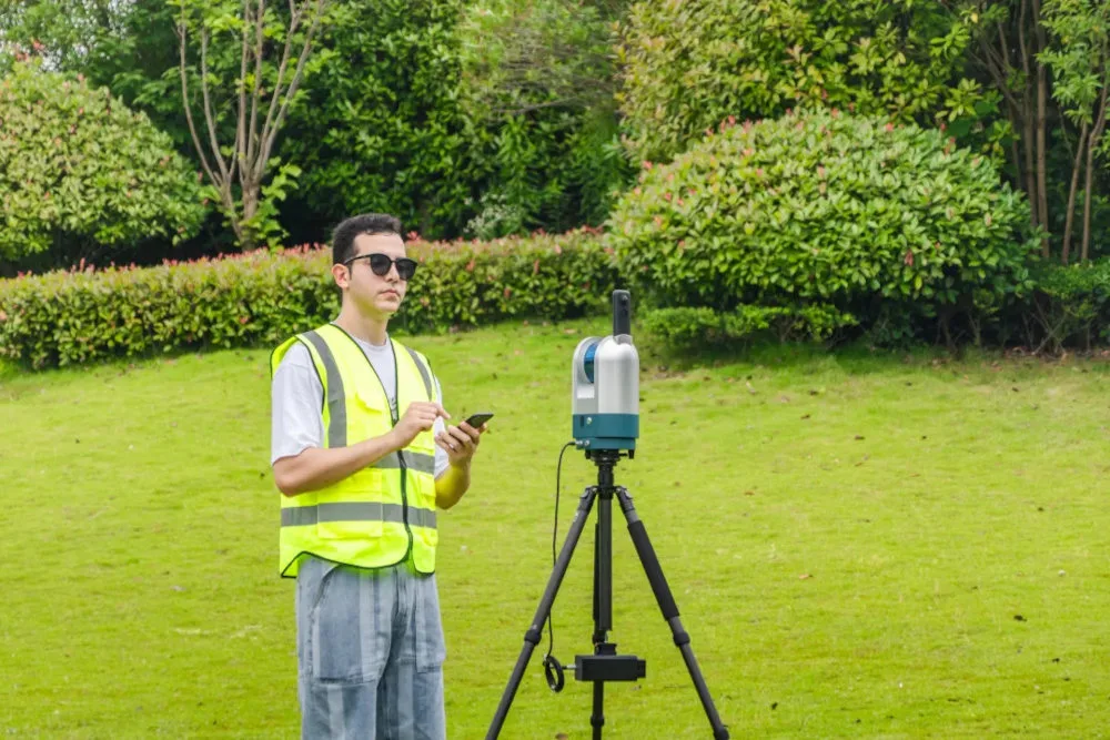 Man using GreenValley International's mobile LiDAR mapping system.