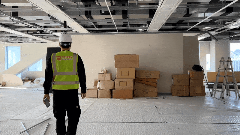 Construction worker capturing 3D digital twin using Cupix software