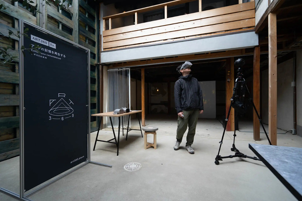man with headset watching VR art exhibitions