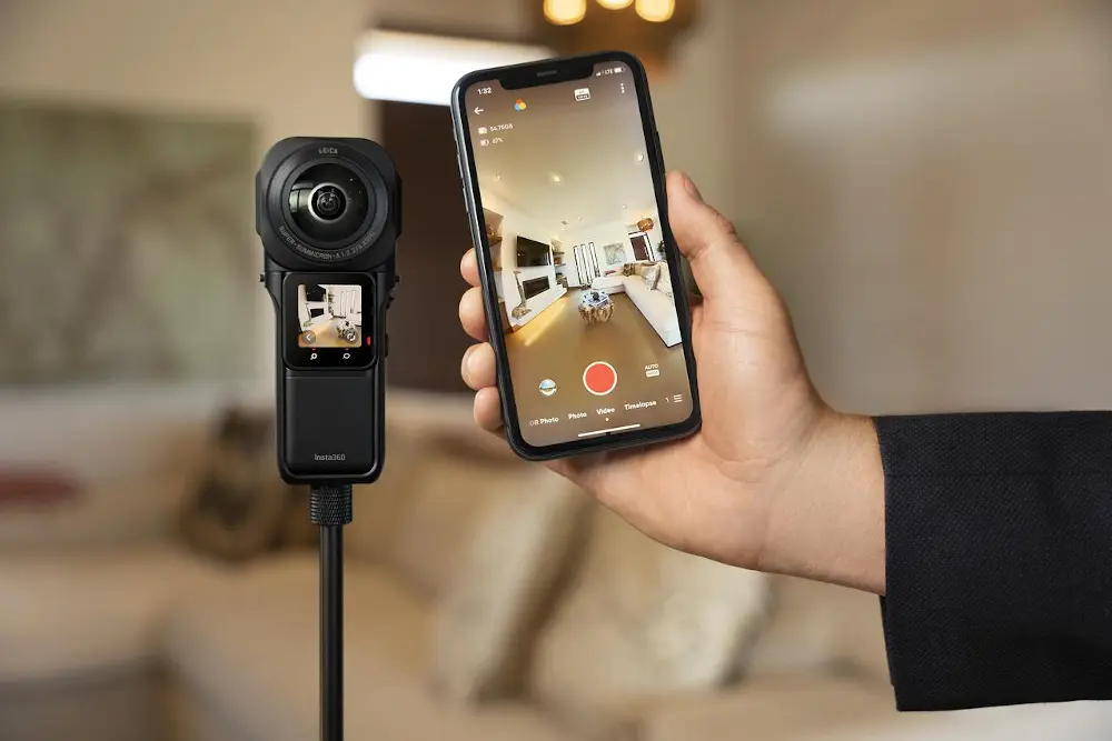 Insta360 RS 1-Inch 360 being used to film a Matterport virtual tour, with a preview of what the camera can see on a mobile phone
