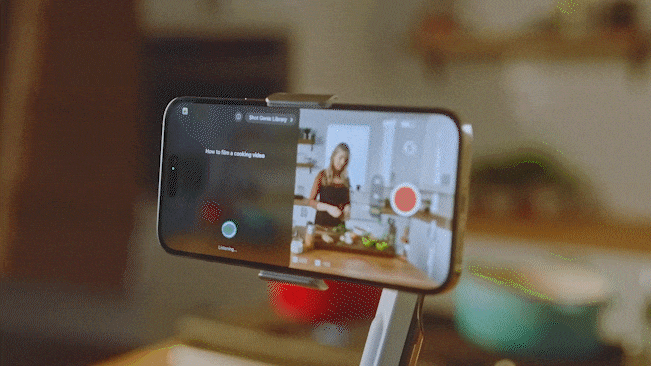 A man using Shot Genie on the Insta360 app to get tips on how to film a woman cooking in a kitchen with Insta360 Flow
