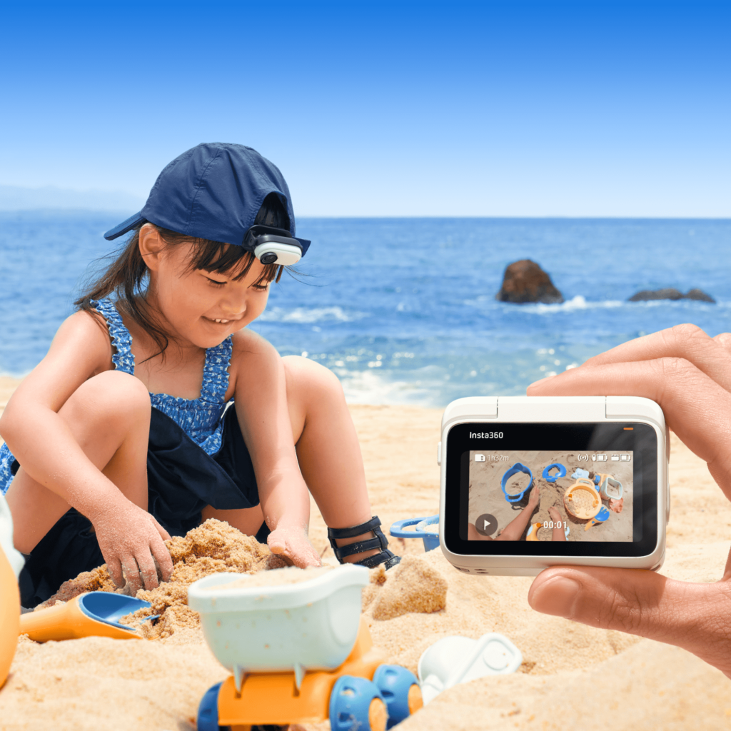 Aufnahme der GO3 mit einem spielenden Kind am Strand.