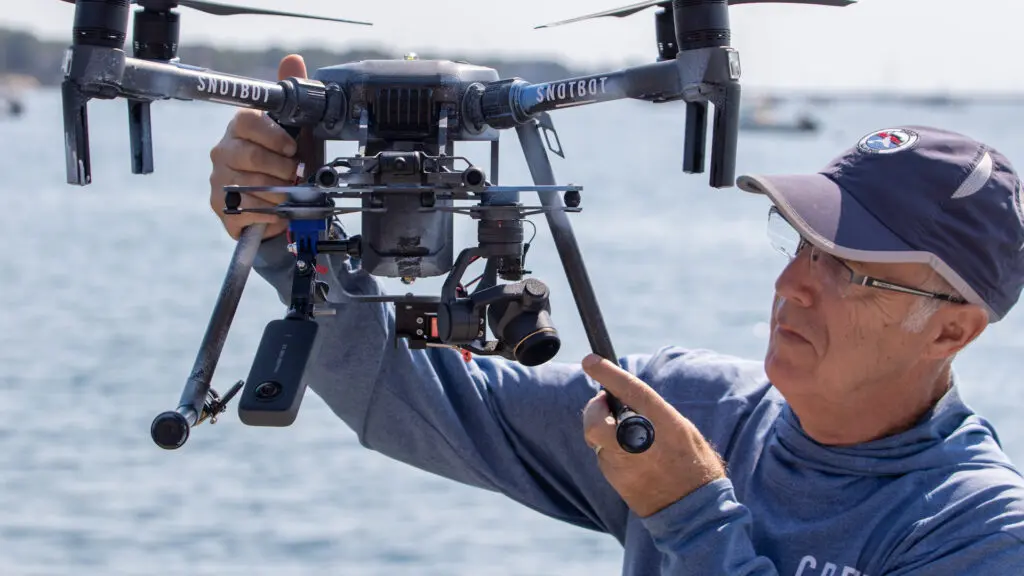 CEO of Ocean Alliance Dr. Iain Kerr with SnotBot.