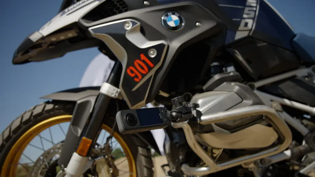 A shot of the Insta360 X3 camera mounted to the side of a BMW motorcycle