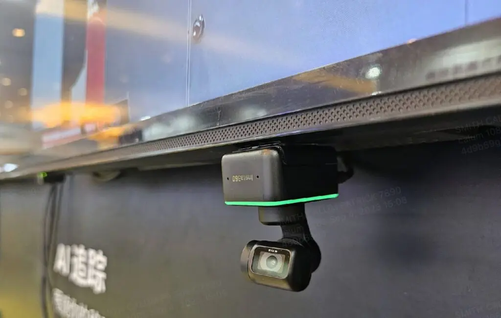 Insta360 Link mounted on the underside of a TV