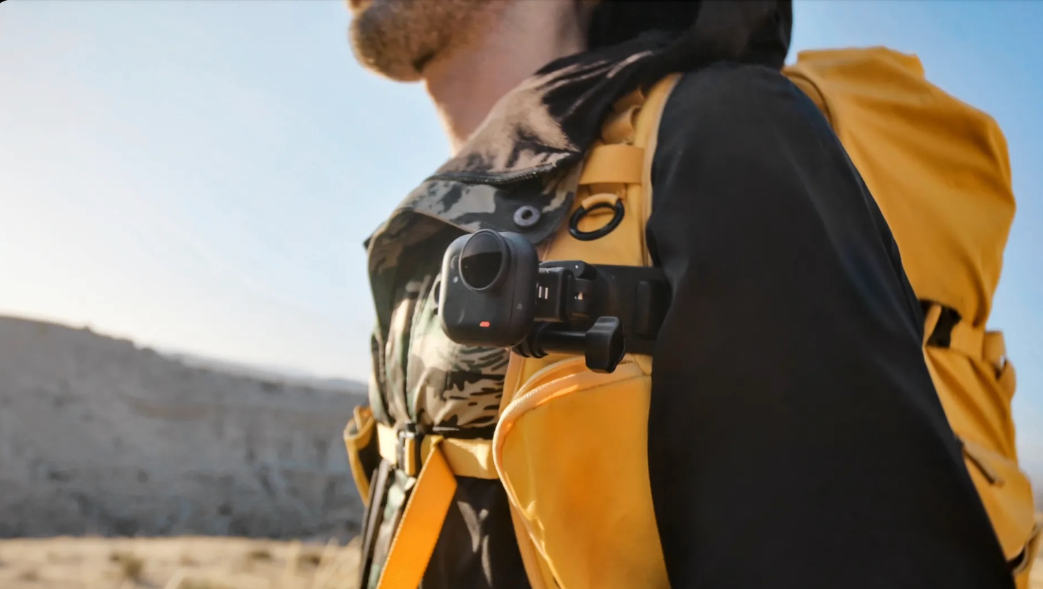 adventure traveler wearing Insta360 GO Ultra quick release mount