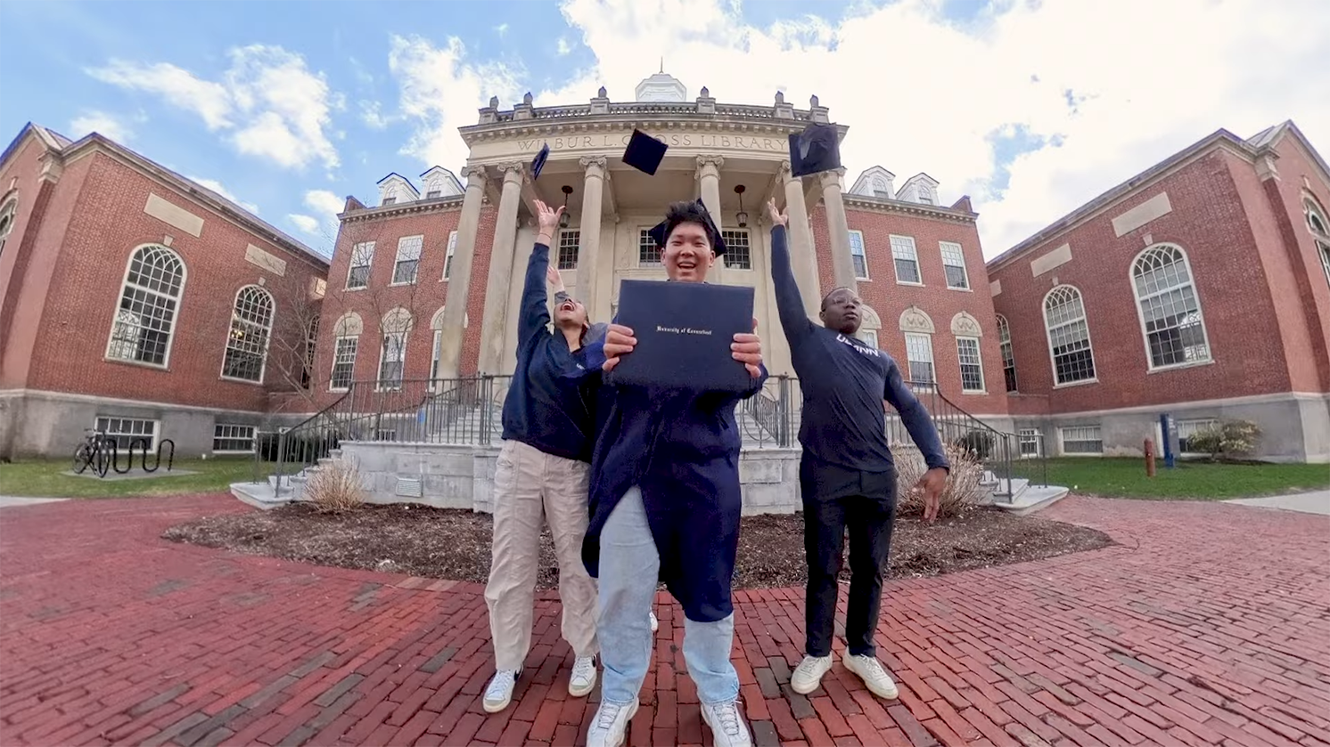 Students celebrating their graduation at UConn.