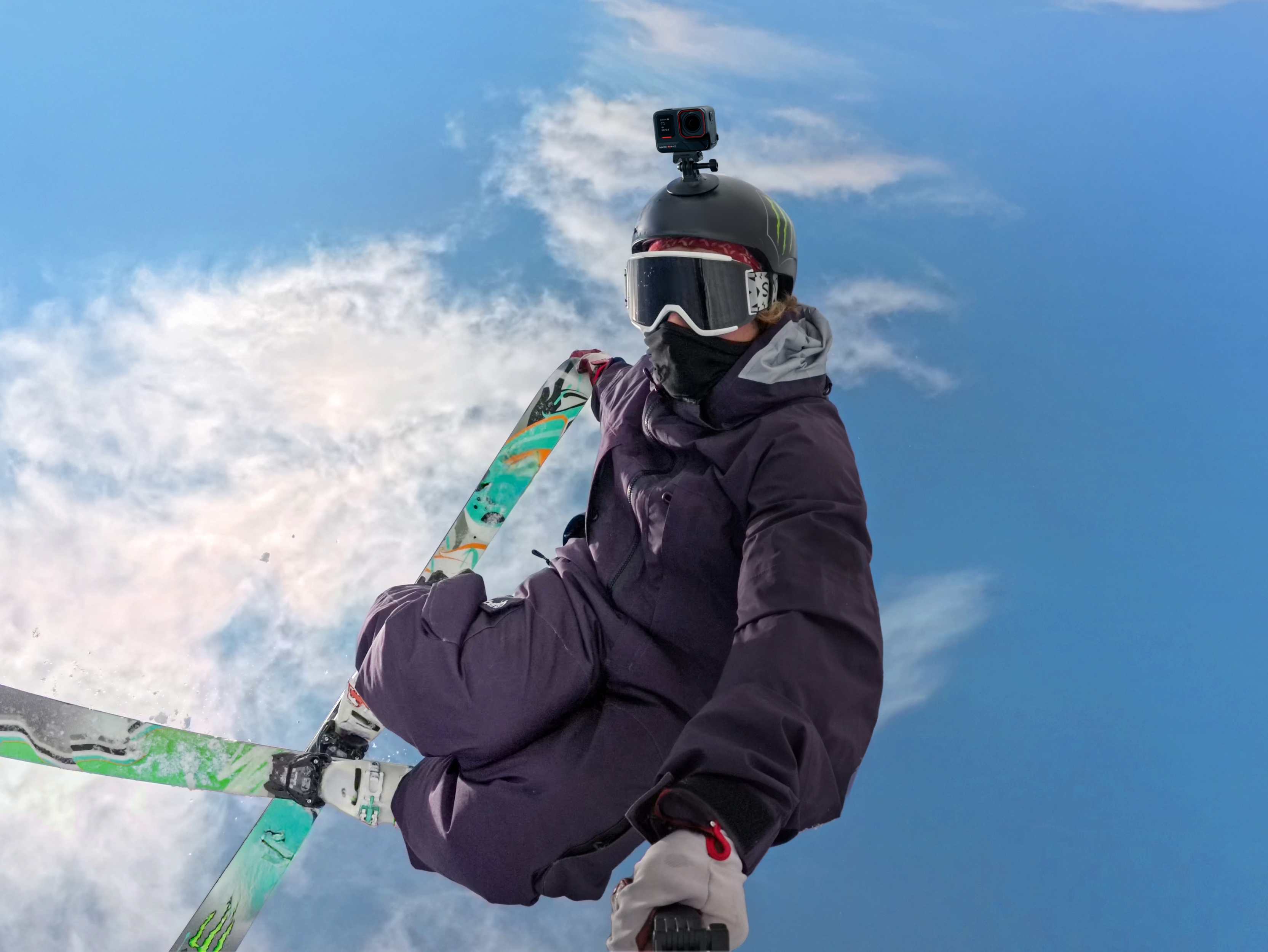 Insta360 Ace Pro 2 mounted on the helmet of a skier doing a flip in the air.