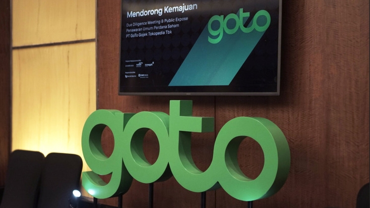 Goto's company logo shown in meeting room.