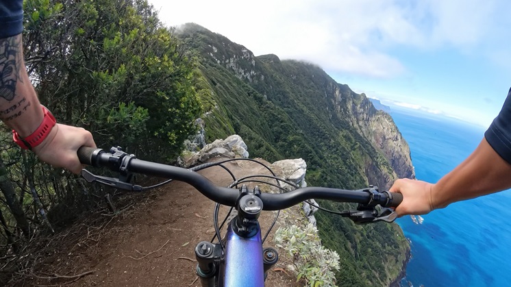 Cycling on the edge of a cliff.