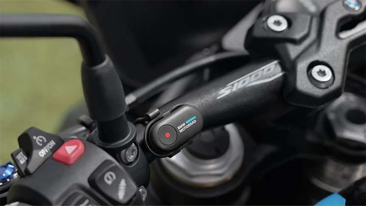 Insta360 Mini remote on motorcycle handlebars