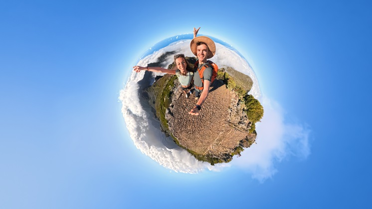 Two people take a 360° photo.