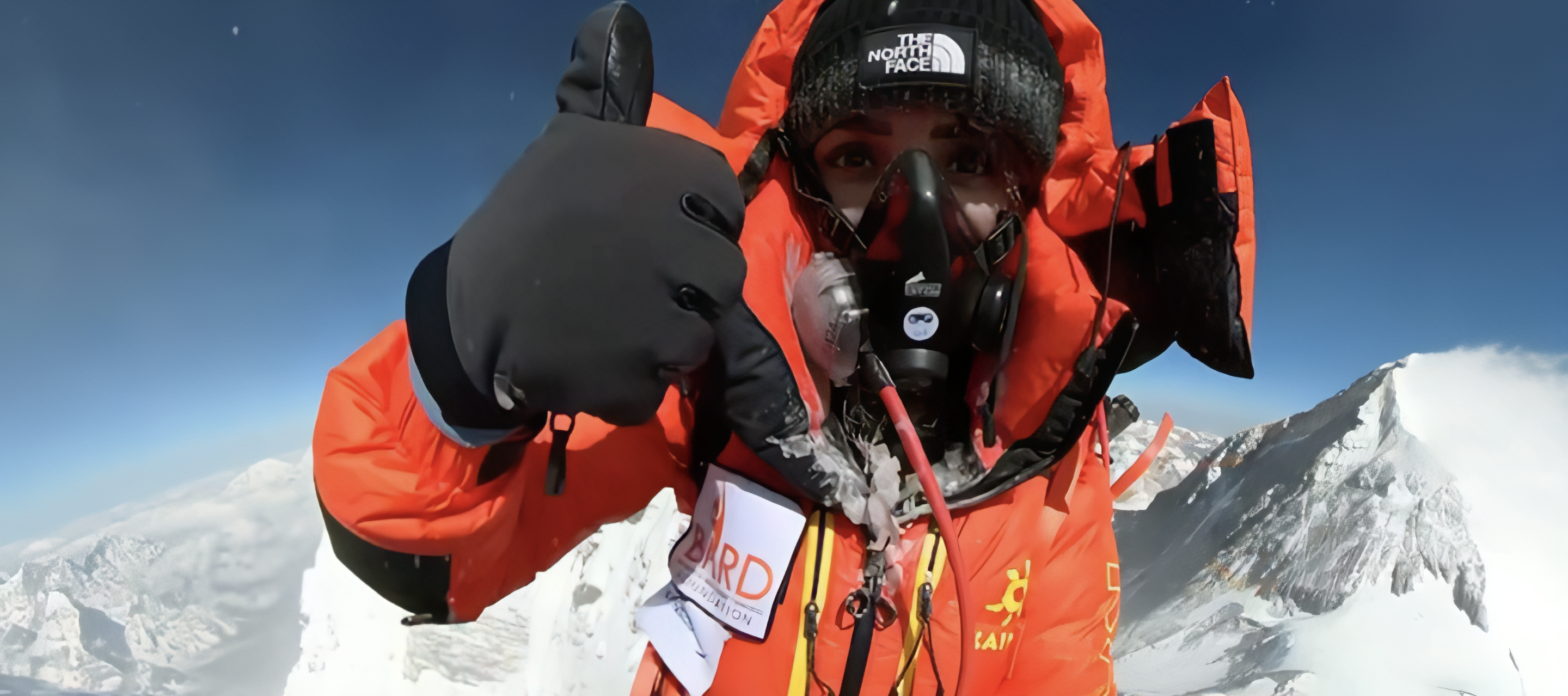 High-altitude mountaineer Naila Kiani gives a thumbs up from Lhotse summit.