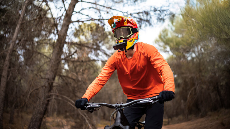 Insta360 X4 Air mounted to a mountain bike helmet.