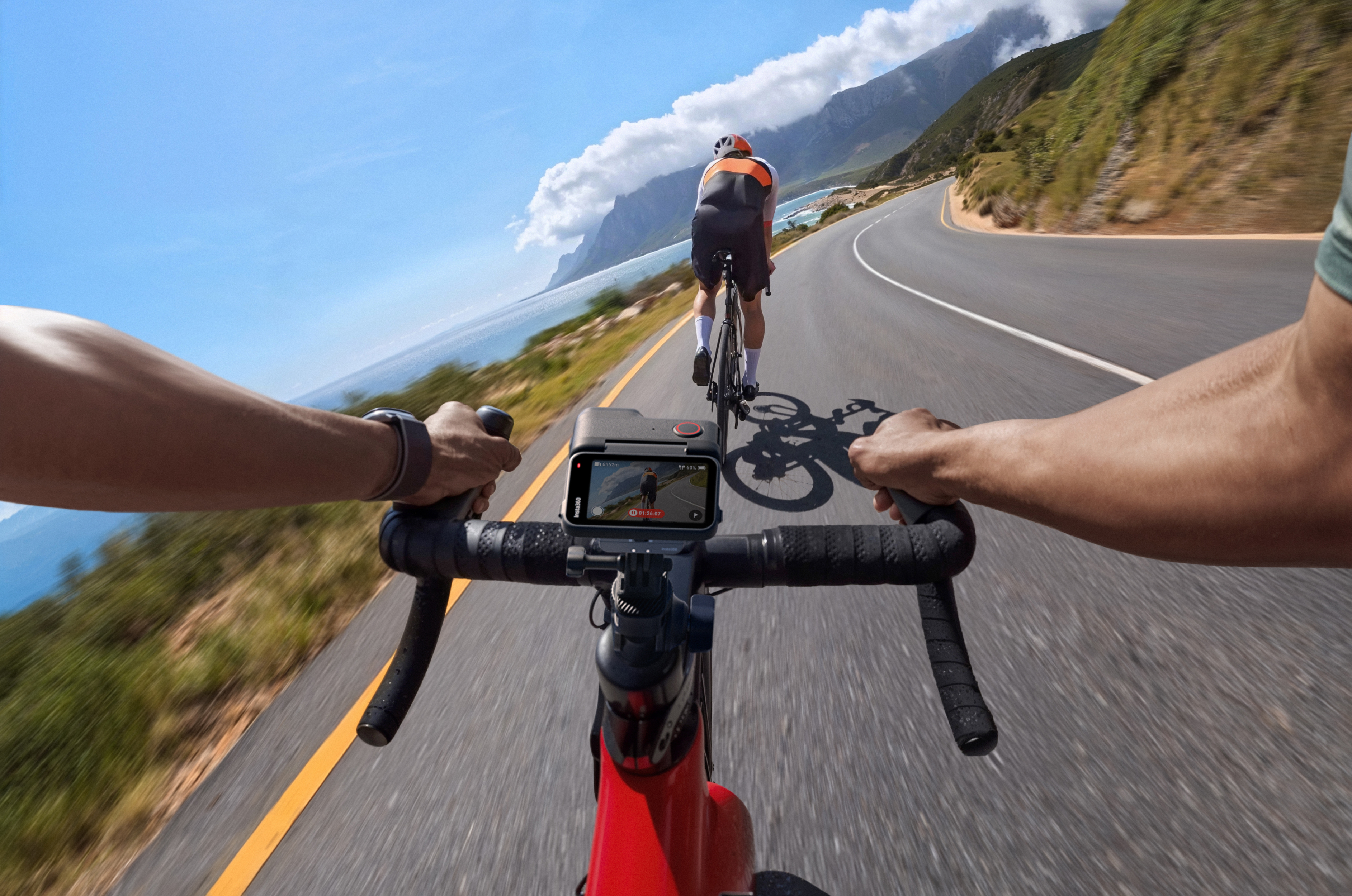 Insta360 Ace Pro attached to the bike's handlebars with the flip touchscreen at a 90-degree angle for easy preview.