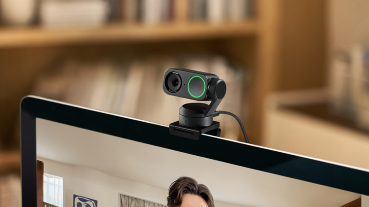 a mac computer setup with the insta360 link 2 webcam