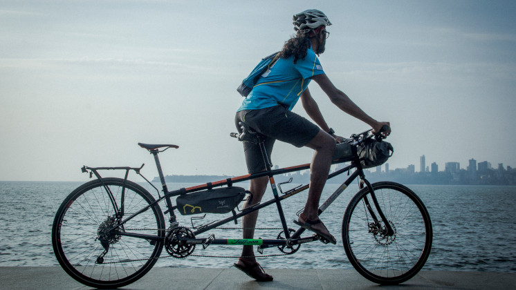 Kumar at the waterfront with his tandem bike